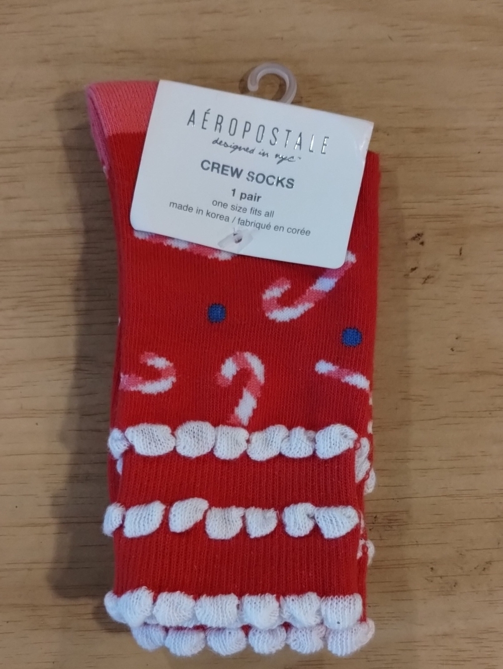 Red Candy Cane Crew Socks with White Pom Accents.   (A49)